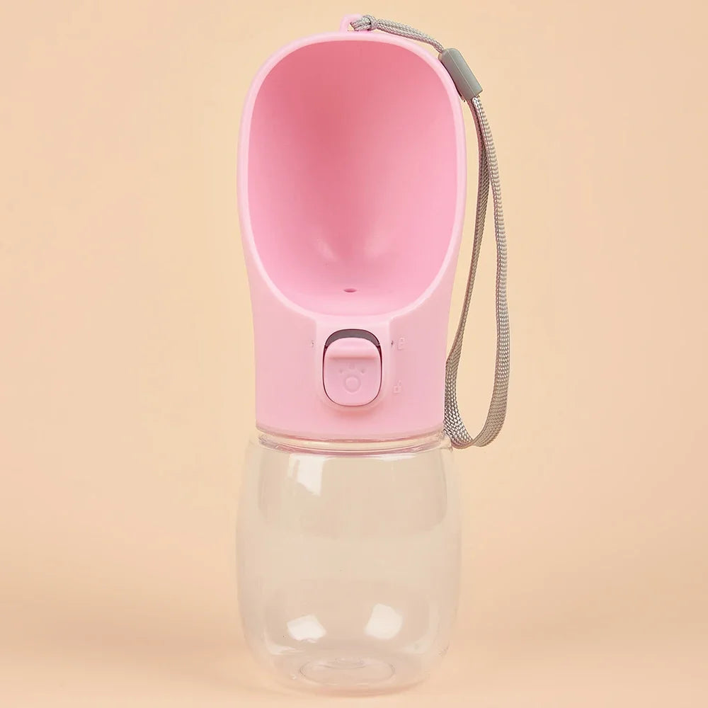 Pink portable dog water bottle with built-in drinking bowl