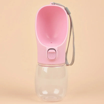 Pink portable dog water bottle with built-in drinking bowl
