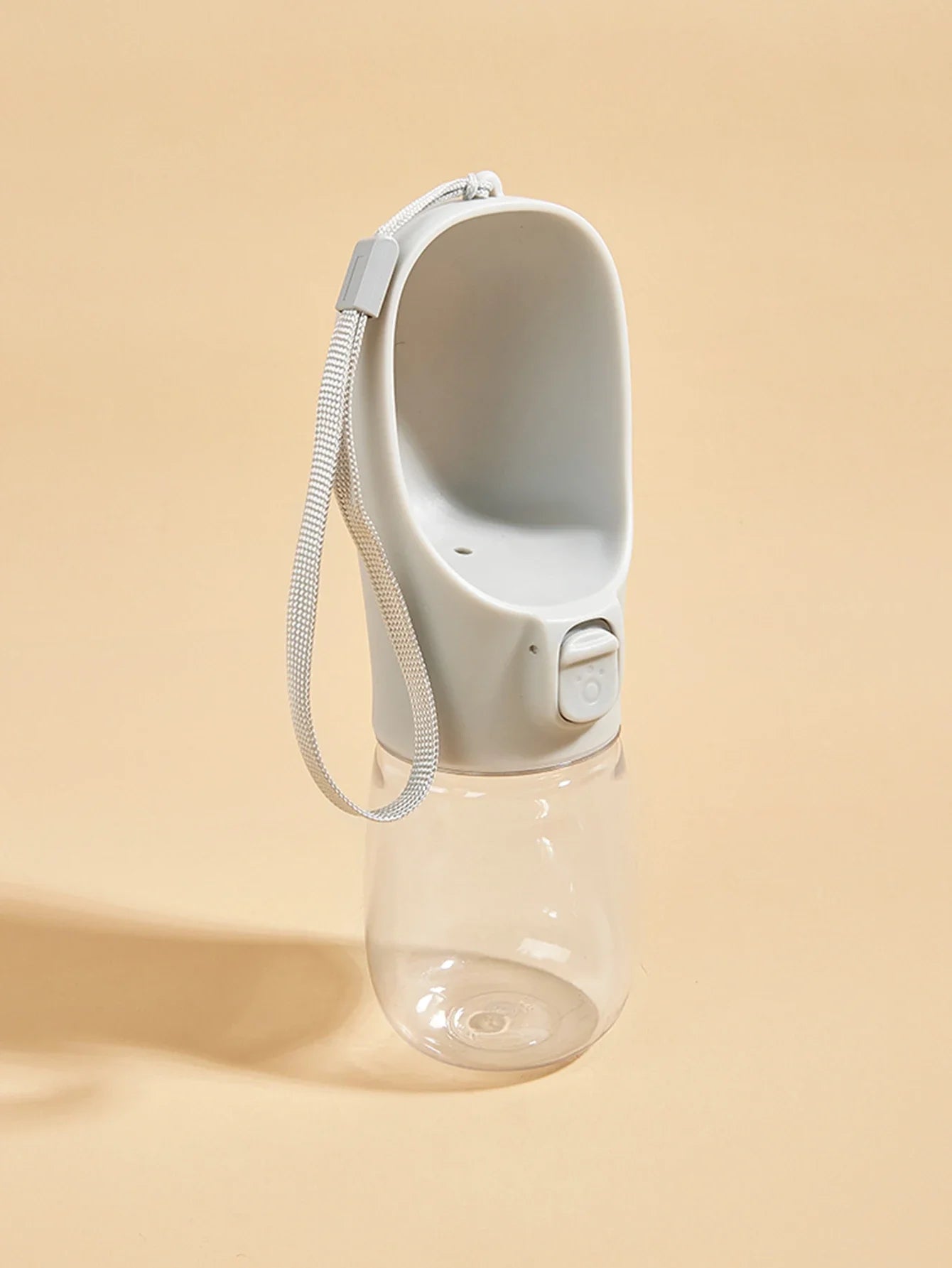 White compact pet water bottle with attached wrist loop